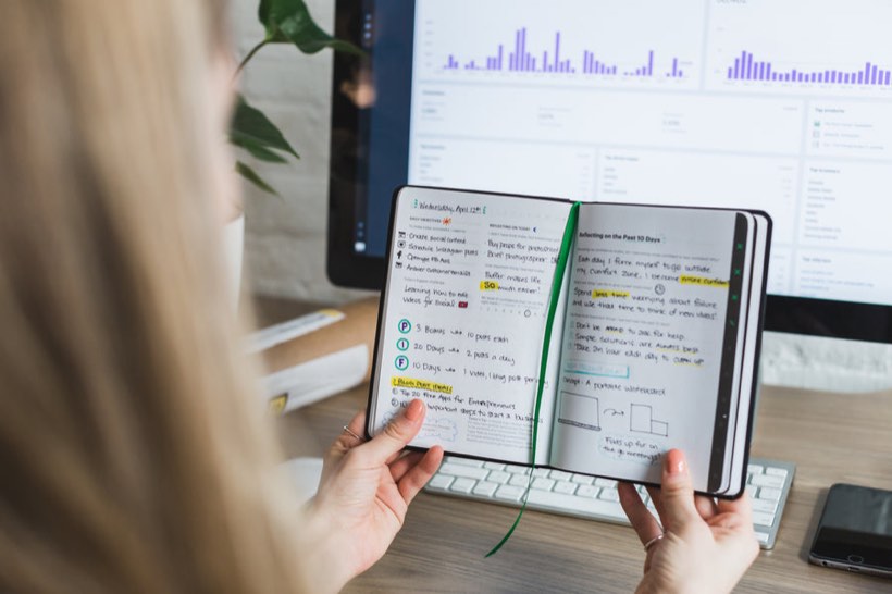 Reading and taking notes at a desk